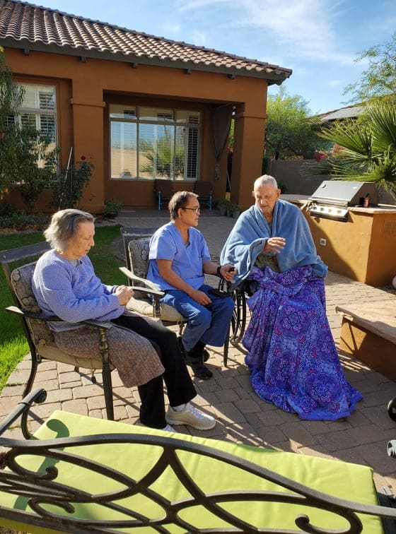 Seniors sitting on a lawn chair